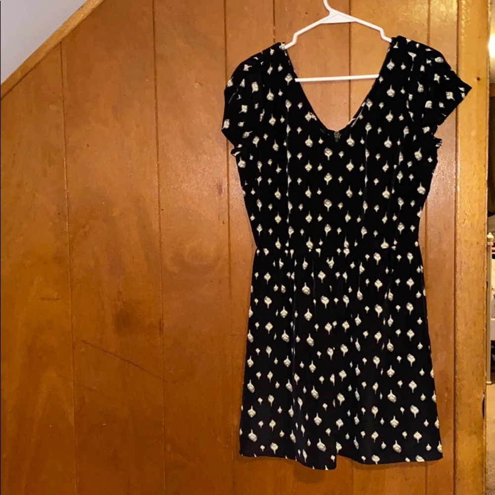 Black dress with white little flowers on it